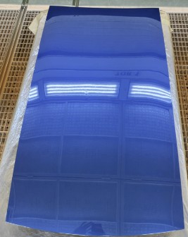 Blue structural PV prototype panel on a drying rack