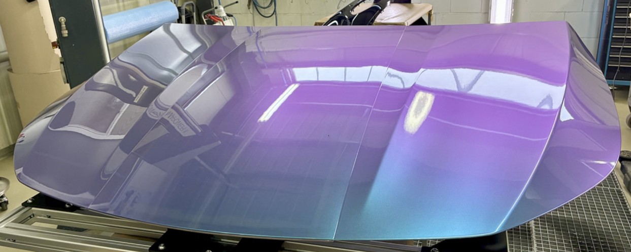 Hood prototype with a colour-shift evaluation finish on a test fixture