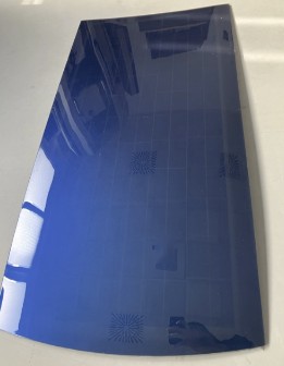 Curved dark blue PV prototype panel with visible cell structure